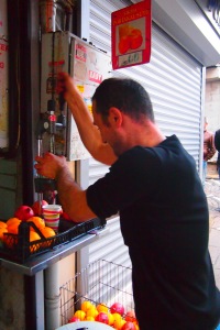 Street seller - rambo style. making the best juice ever (at least for that moment).